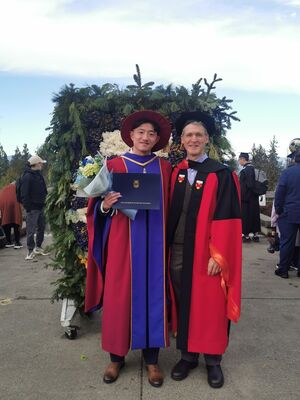 Zhenan Fan (PhD 2022) and Michael Friedlander at UBC PhD graduation ceremony